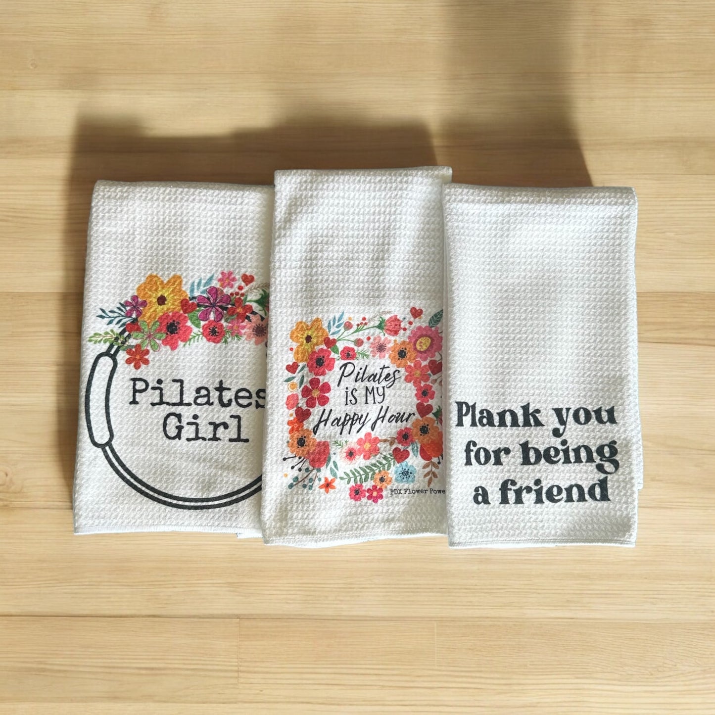 Pilates Girl towel set. Pilates girl floral ring towel, floral Pilates is my happy hour towel and Plank, Plank you for being a friend towel.