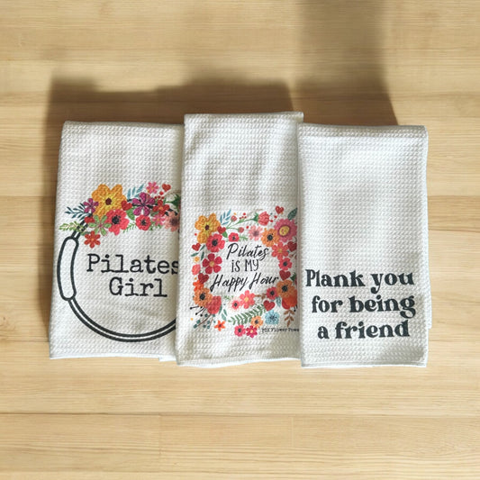 Pilates Girl towel set. Pilates girl floral ring towel, floral Pilates is my happy hour towel and Plank, Plank you for being a friend towel.